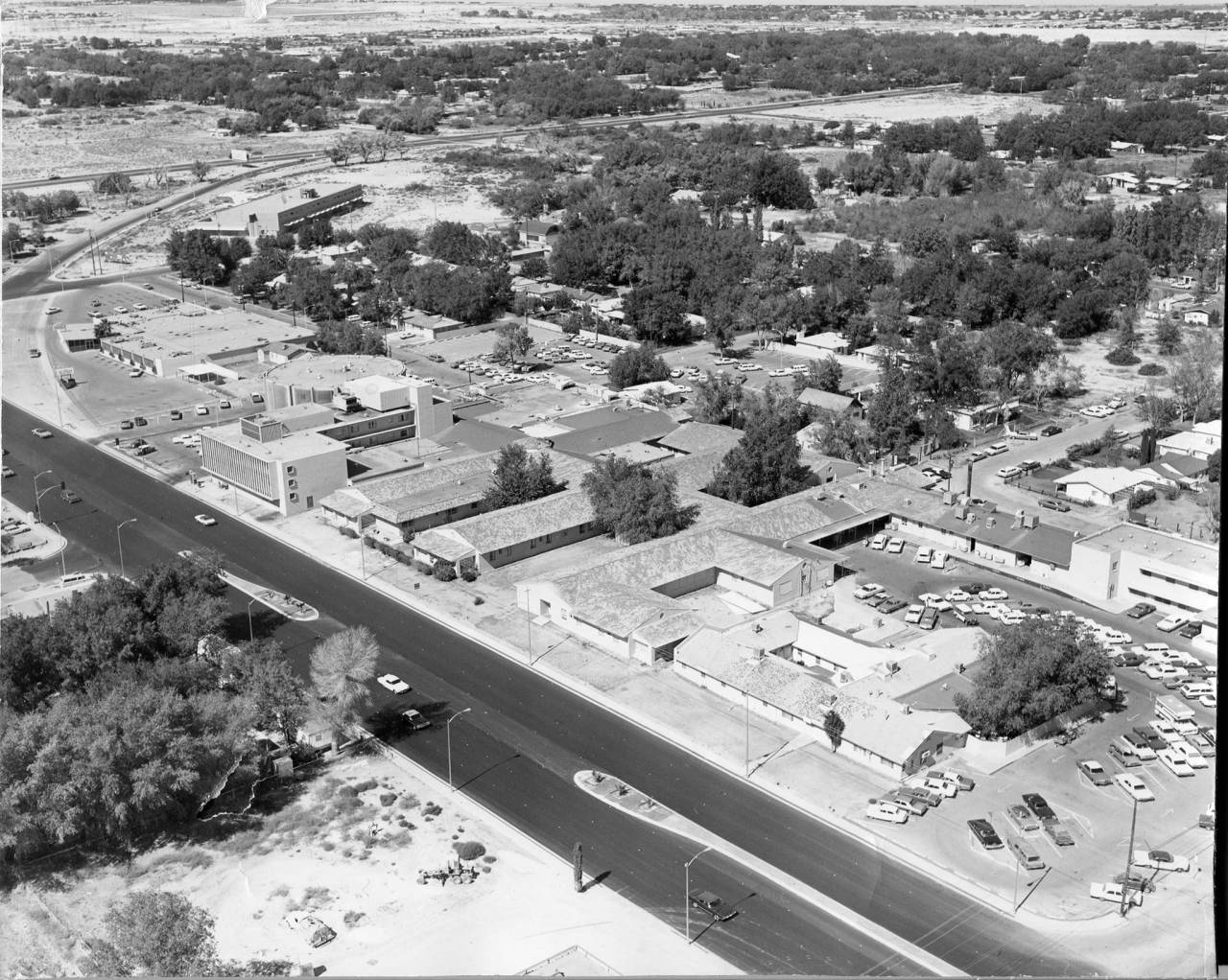 Historic aerial photograph of Rancho Drive and Charleston Boulevard, with tree-lined rural lots stretching toward the horizon